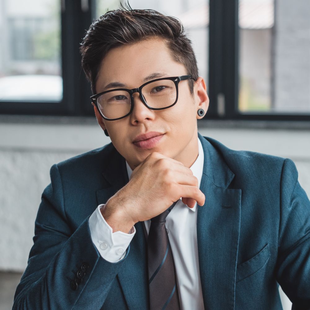 Handsome young asian businessman in suit and eyegl QNR7Z5E 1.jpg